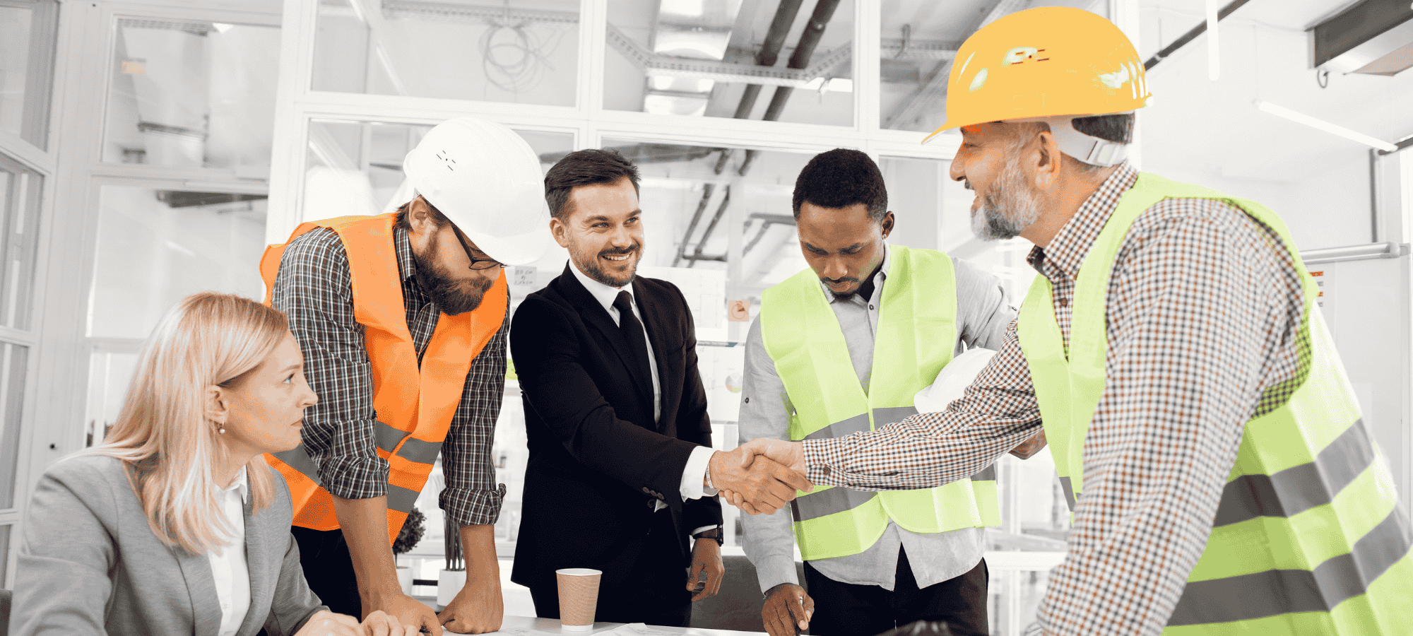 Construction professionals and suppliers collaborating on a project plan, representing Site Connected’s platform that bridges contractors, suppliers, and service providers.