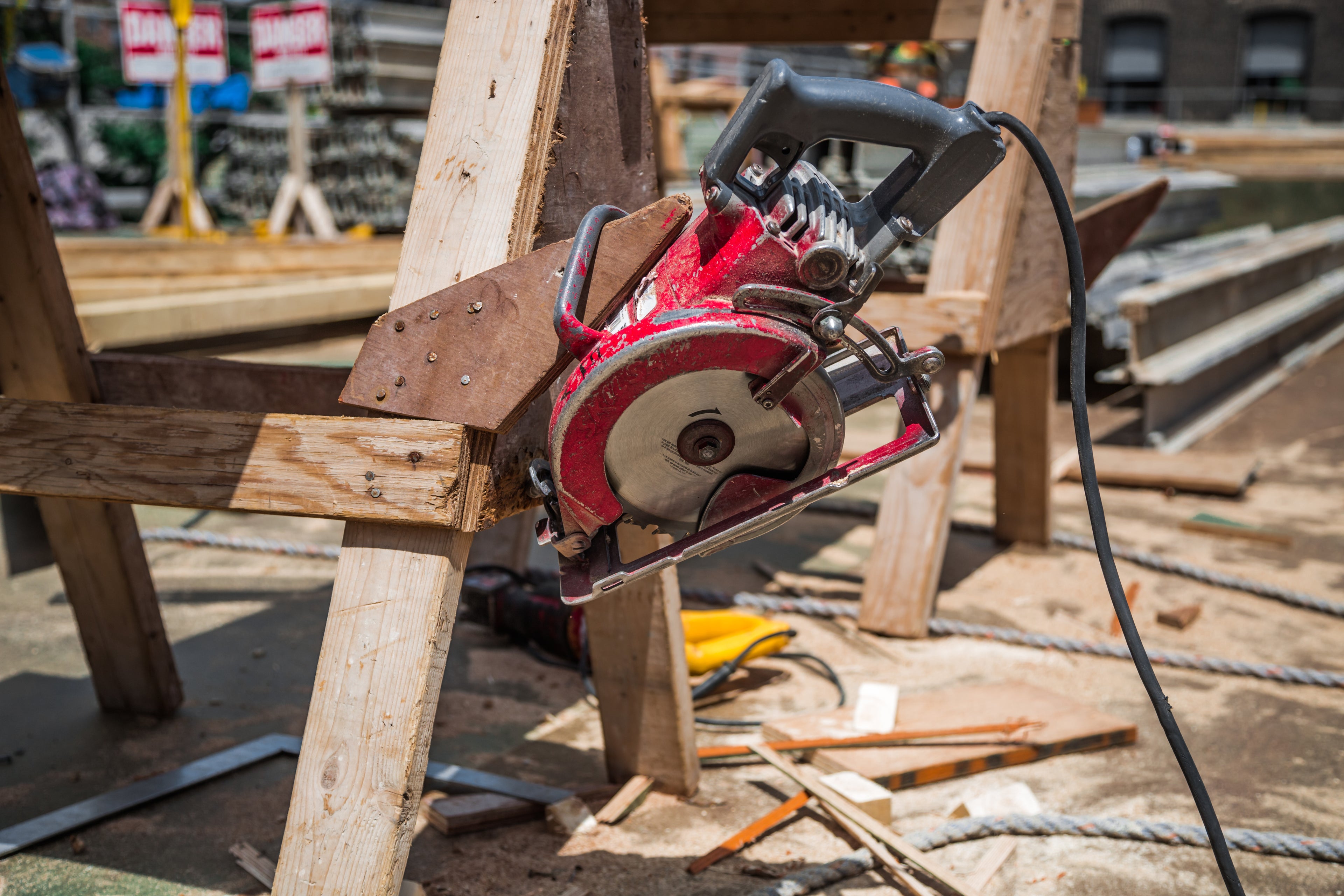 Close-up of a circular saw and building materials on a construction site, representing Site Connected’s platform for sourcing services, equipment, and materials.