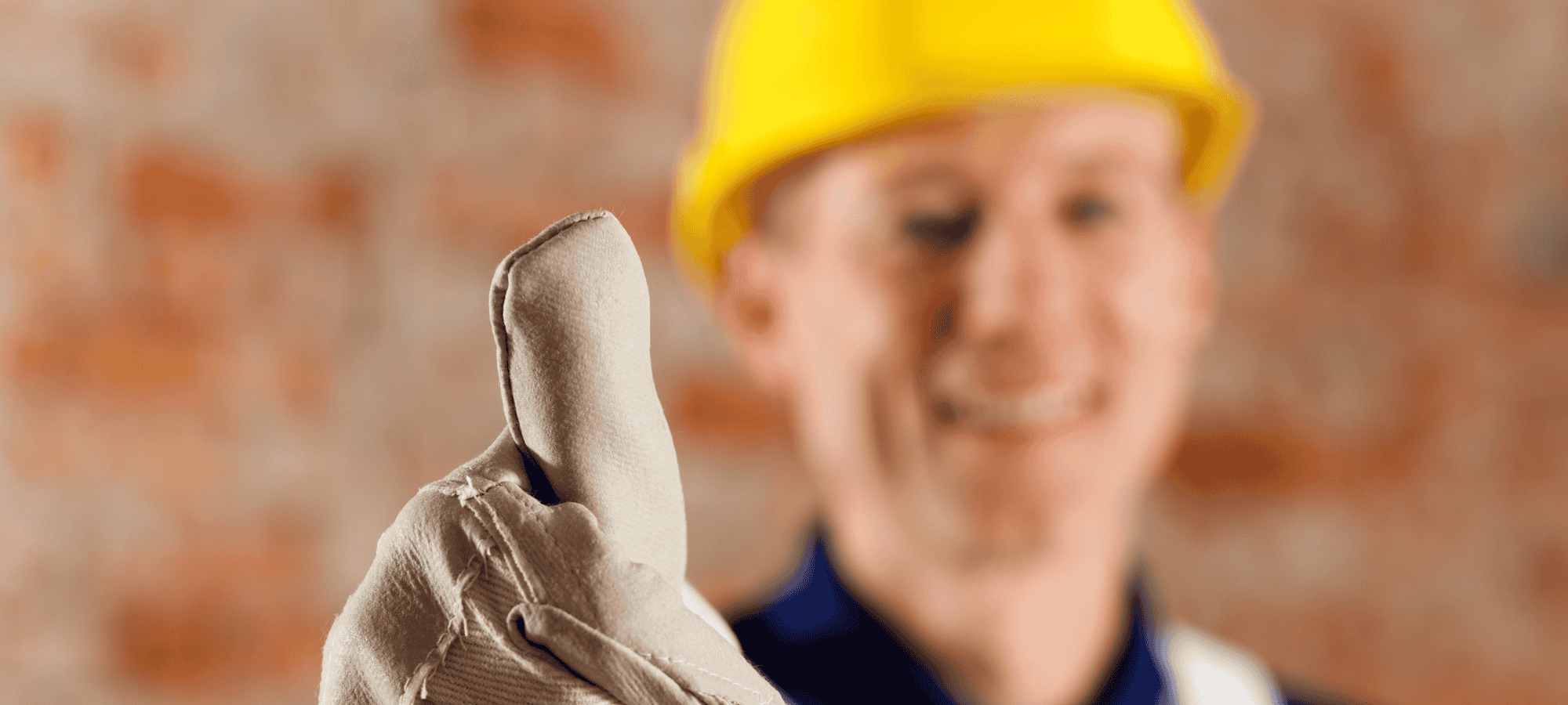 Smiling construction worker giving thumbs up, reflecting Site Connected’s reliability and promise to deliver on time, every time.